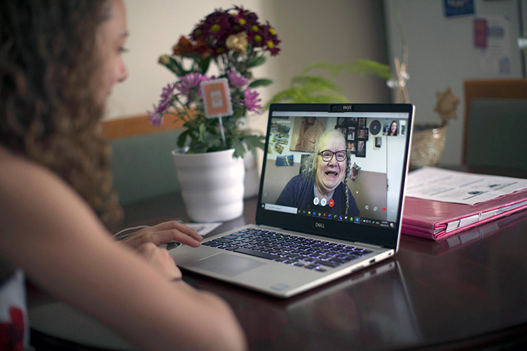 Naomi Mison, who is hosting an event to discuss virtual solutions to support loved ones during COVIID-19, has a conversation with her mother on Skype.
