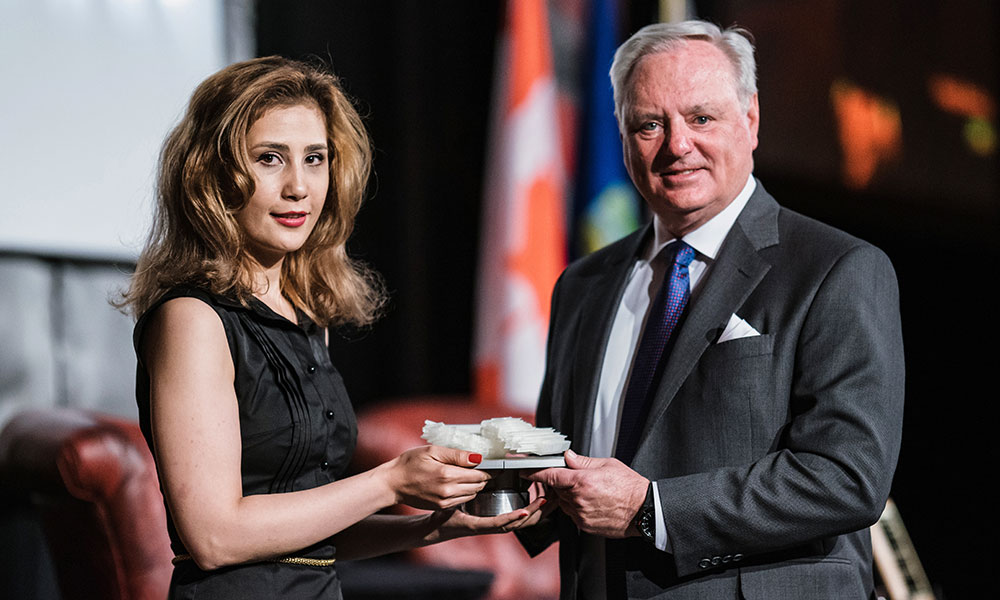 Bavi receiving the University of Calgary's Distinguished Artist Award and Scholarship in 2019