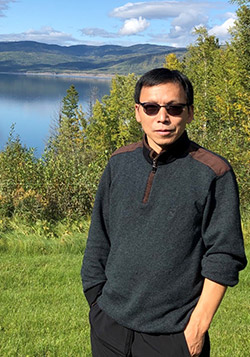Dr. Adam Wei, professor of earth, environmental and geographic sciences, visits the Williston Reservoir near Fort St. John, BC.
