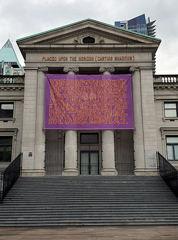 Whess Harman’s artwork was hung outside the Vancouver Art Gallery just days before the current display of 215 pair of shoes symbolizing the death 215 Indigenous children was placed. Harman’s banner states how land acknowledgements are not enough and how they are the lowest bar in the process of truth and reconciliation for the Indigenous peoples.